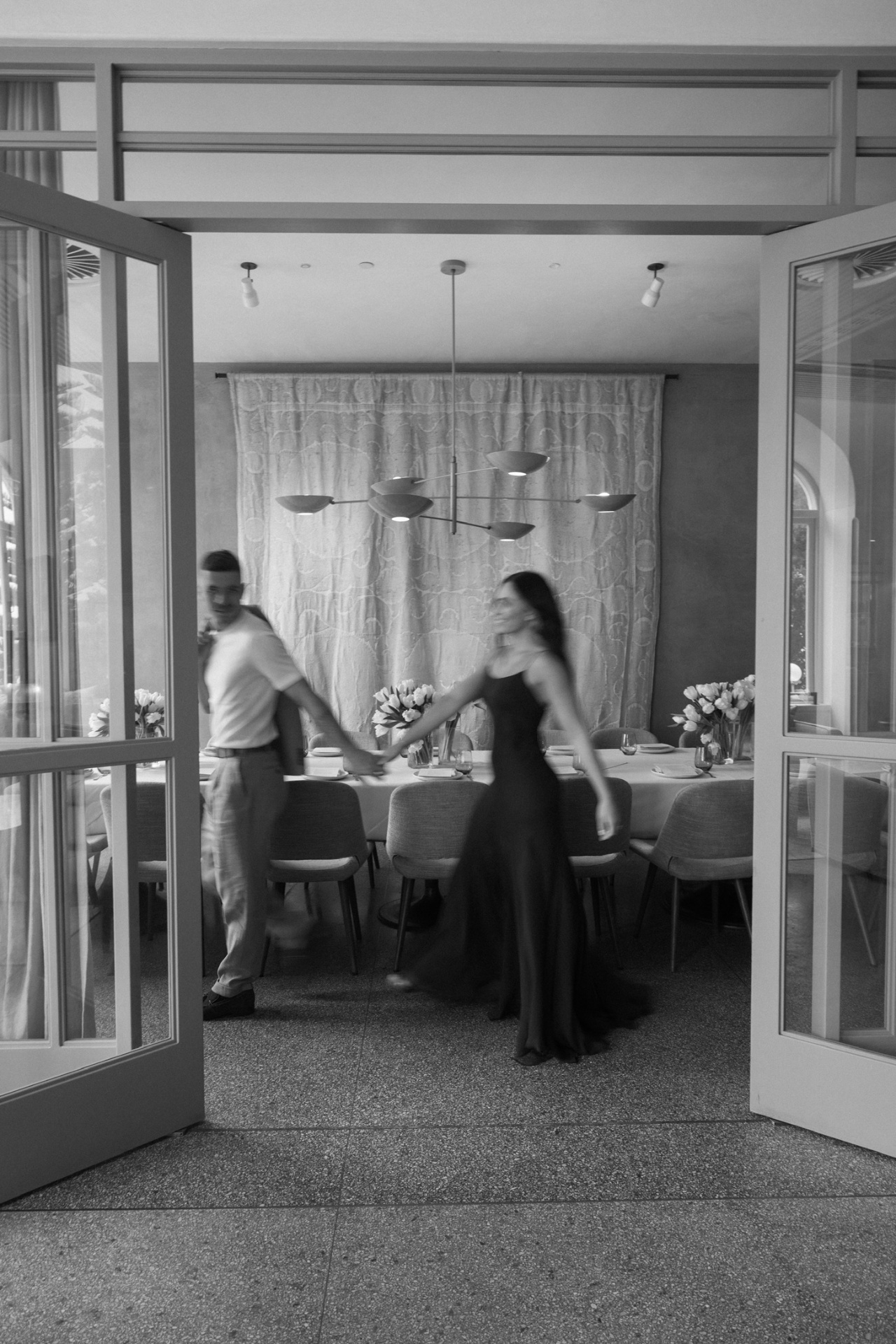 Soft motion-blurred black and white image of the couple